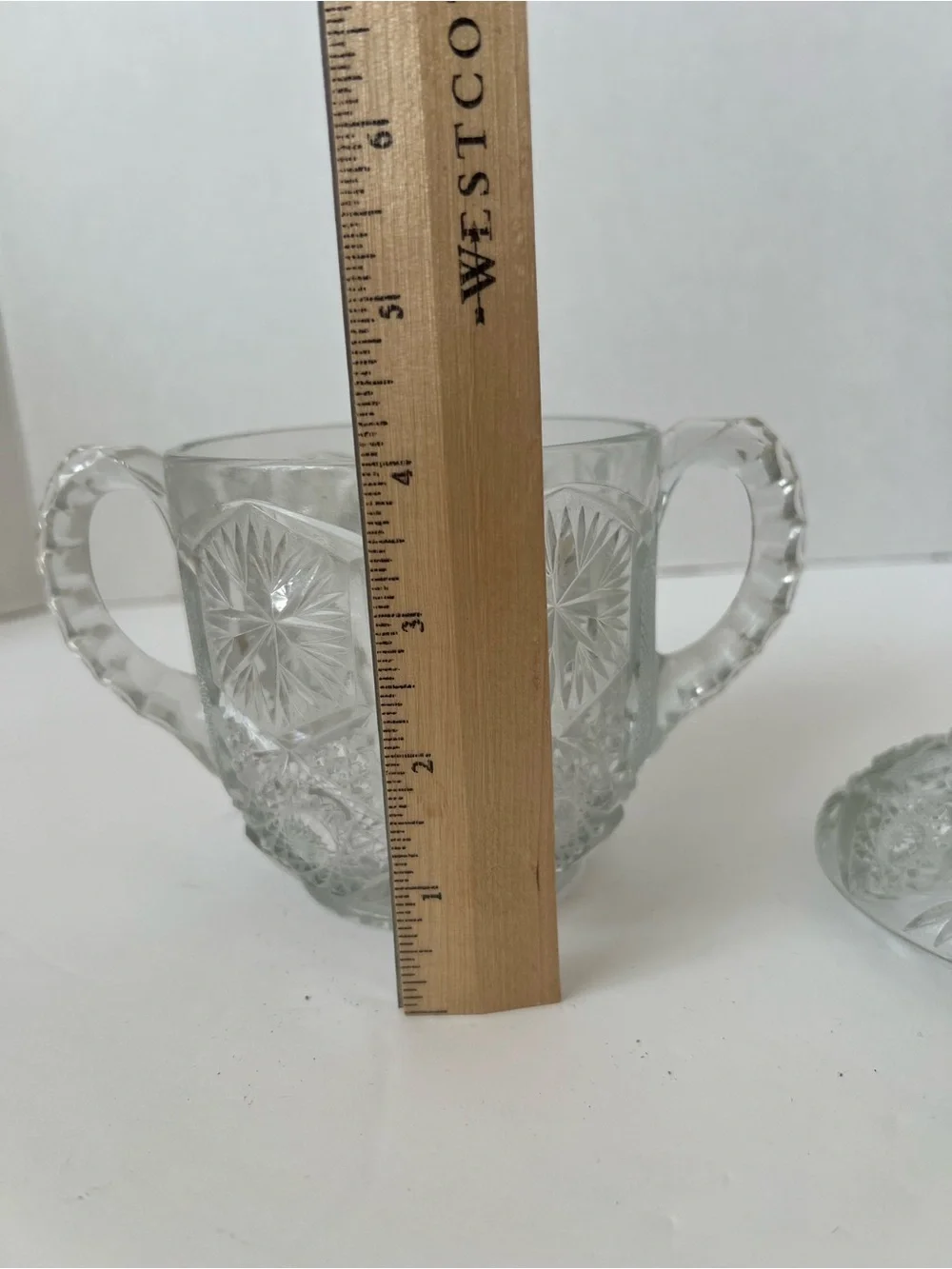 This is a vintage clear pressed-glass covered sugar bowl with 2 handles & lid